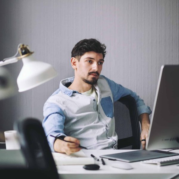 handsome-businessman-working-in-office.jpg handsome-businessman-working-in-office.jpg
